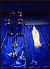 Stigmata Crutch next to Plastic Bottle in the form of the Virgin Mary - a Lourdes Souvenir