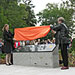 Netherlands Consul in Toronto Astrid de Vries, Head of Economic and Cultural Affairs, and Honorary Consul Irene Bakker in Calgary remove the shroud for the unveiling of the Memorial