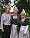 Members of the Dutch Klompen Dancers hand out boutonnieres to the veterans present.